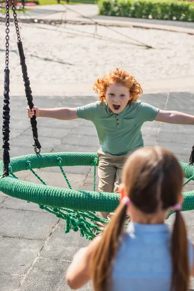 Thrilled Boy Open Mouth Having Fun Hammock Blurred Sister — Stock Photo, Image