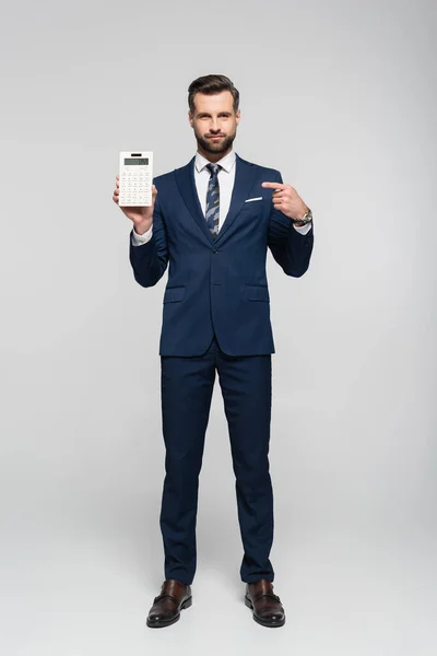 Full Length View Economist Blue Suit Pointing Calculator Grey — Stock Photo, Image