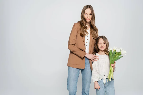 Happy Girl Holding Bouquet Tulips Mother Isolated Grey — Stock Photo, Image