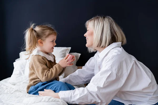 Side View Happy Woman Looking Daughter Sitting Bed Gift Box — Stock Photo, Image