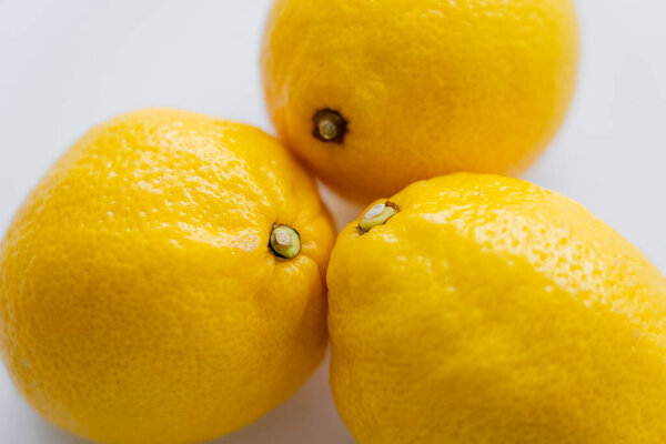 Top view of organic lemons on white background 