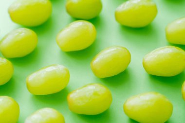 flat lay of delicious organic grapes on green