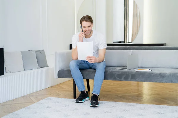 Full Length View Man Paper Talking Mobile Phone Laptop Sofa — Stock Photo, Image