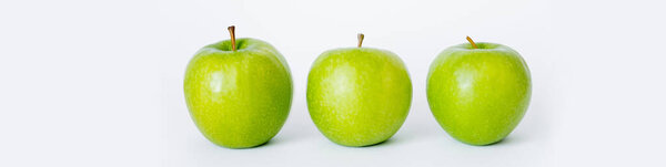 row of green and ripe apples on white, banner