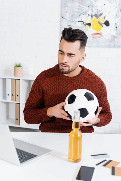 Concentrated Bookmaker Soccer Ball Looking Laptop Bottle Beer Credit Cards — Stok Foto