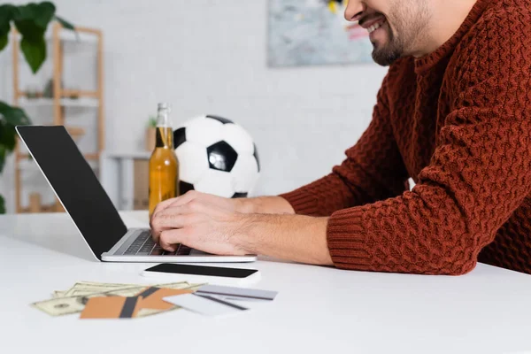 Cropped View Smiling Bookmaker Typing Laptop Credit Cards Soccer Ball — Stockfoto