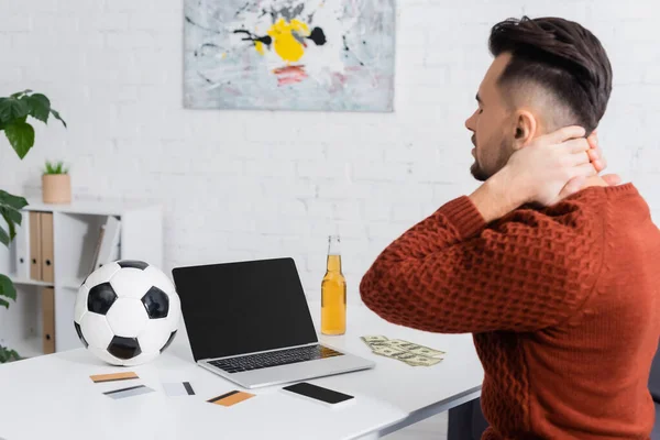 Upset Gambler Sitting Laptop Blank Screen Credit Cards Soccer Ball — Fotografia de Stock