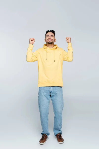 Full Length Cheerful Bookmaker Showing Triumph Gesture Looking Grey — Foto Stock