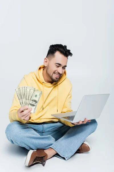 Happy Bookmaker Sitting Dollar Banknotes Laptop Grey — Foto de Stock
