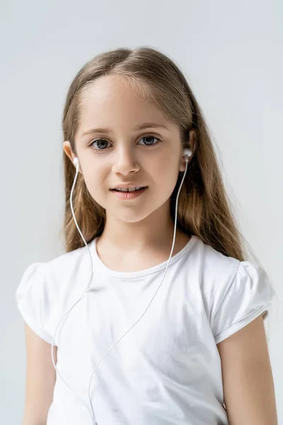 Joyful Girl Earphones White Shirt Looking Camera Isolated Grey — Stock Photo, Image