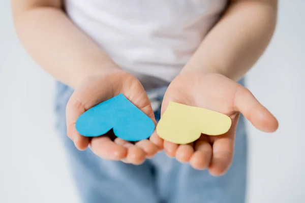 Cropped View Blurred Kid Holding Blue Yellow Paper Hearts Open — ストック写真