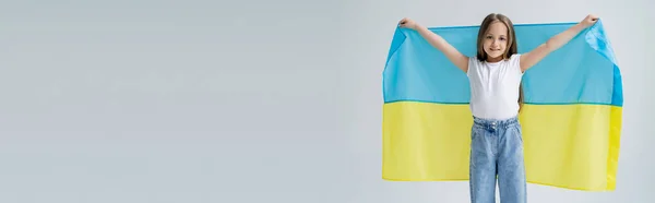 Joyful Patriotic Girl Ukrainian Flag Smiling Camera Isolated Grey Banner — Stock Photo, Image
