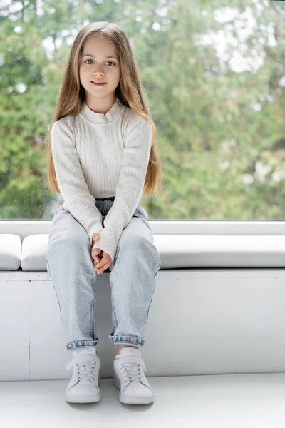 Full Length View Girl Jeans Sitting Windowsill Looking Camera — ストック写真