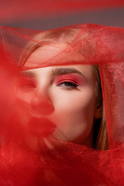 Model Red Eye Shadow Looking Camera Blurred Cloth Grey Background — Stock Photo, Image