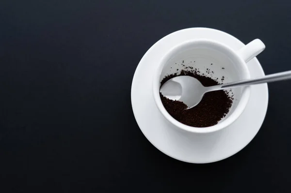 Top View Ground Coffee Cup Spoon Black — стоковое фото