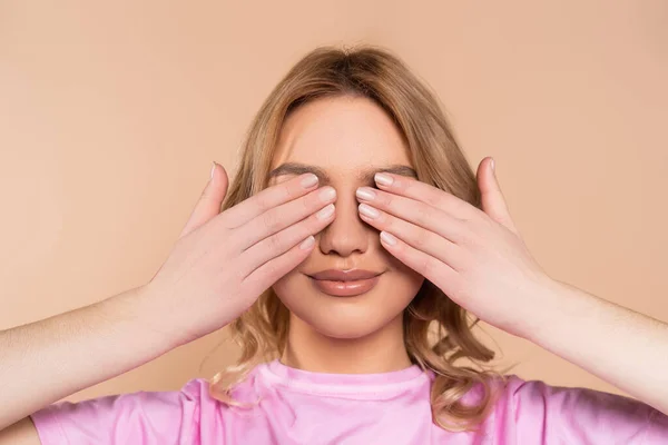 Smiling Woman Covering Eyes Hands Isolated Beige — Stock Photo, Image