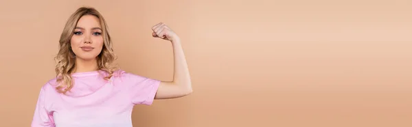 Smiling Woman Looking Camera Showing Muscles Isolated Beige Banner — Stockfoto