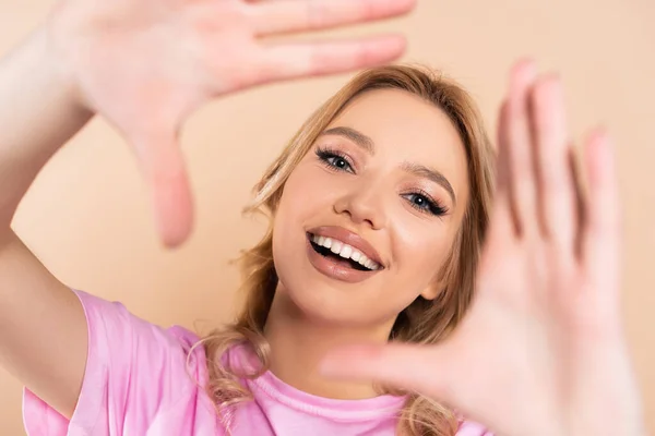 Cheerful Young Woman Gesturing Camera Isolated Beige — Stock Photo, Image
