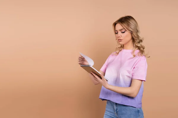 Thoughtful Woman Looking Notebook Isolated Beige — Stock Photo, Image