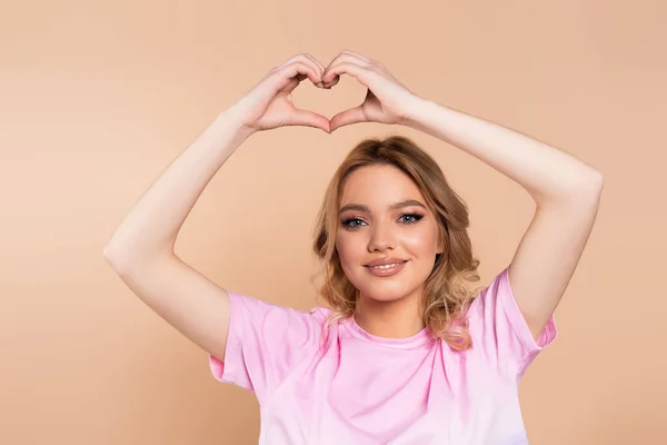 Happy Woman Shirt Showing Heart Sign Head Isolated Beige — ストック写真