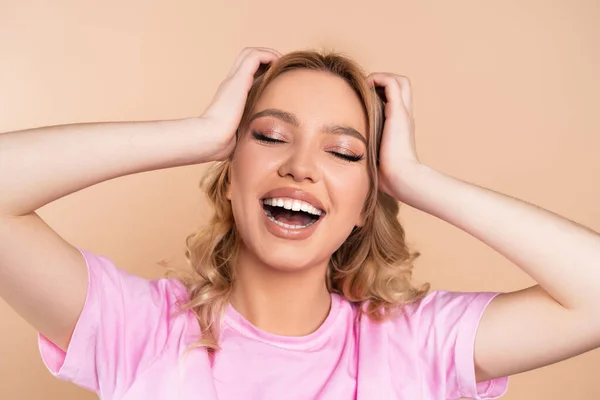 Excited Woman Touching Head While Laughing Closed Eyes Isolated Beige — Stock Fotó