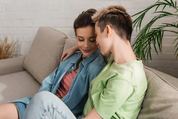 Young Happy Pangender People Sitting Couch Home — Φωτογραφία Αρχείου