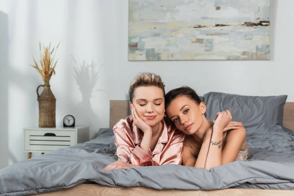 Pangender Person Closed Eyes Young Lover Looking Camera Bed — Stockfoto