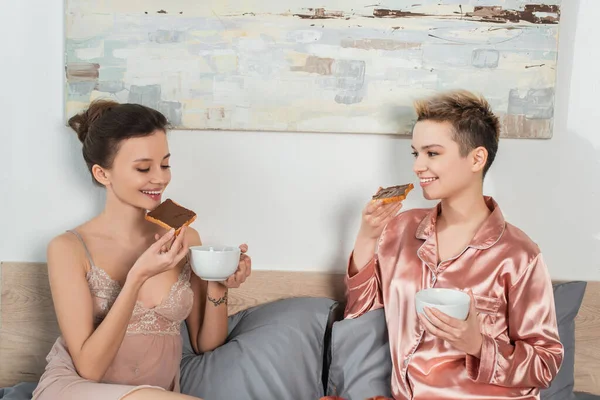 Happy Pangender People Drinking Tea Sweet Toast Bread Breakfast Bedroom — ストック写真