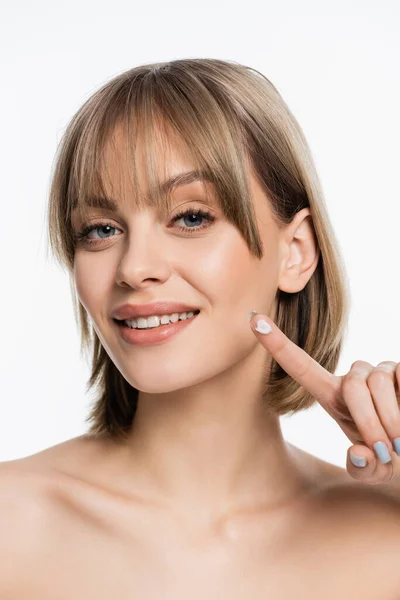 Happy Young Woman Bangs Showing Finger Face Cream Isolated White —  Fotos de Stock