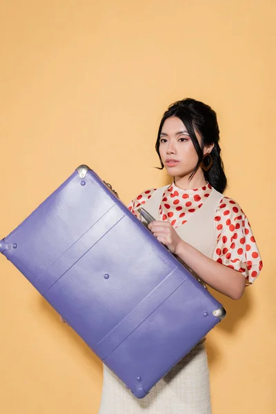 Young Asian Woman Retro Clothes Holding Suitcase Orange Background — Stock Photo, Image
