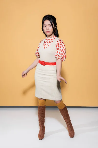 Full Length Trendy Asian Model Retro Clothes Looking Camera Orange — Stock Photo, Image