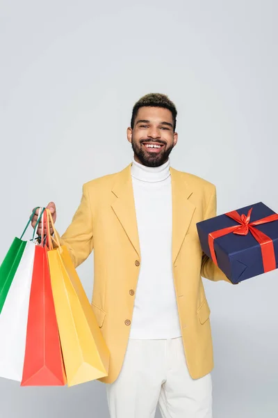Happy African American Man Yellow Stylish Blazer Holding Wrapped Present — Stock Photo, Image