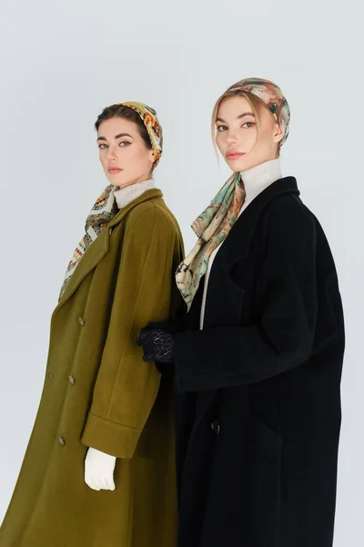 Women Elegant Kerchiefs Coats Looking Camera Isolated Grey — Stock Photo, Image