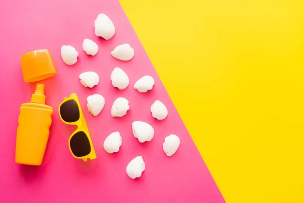 Top View Sunblock Sunglasses Seashells Pink Yellow Background — Stock Photo, Image