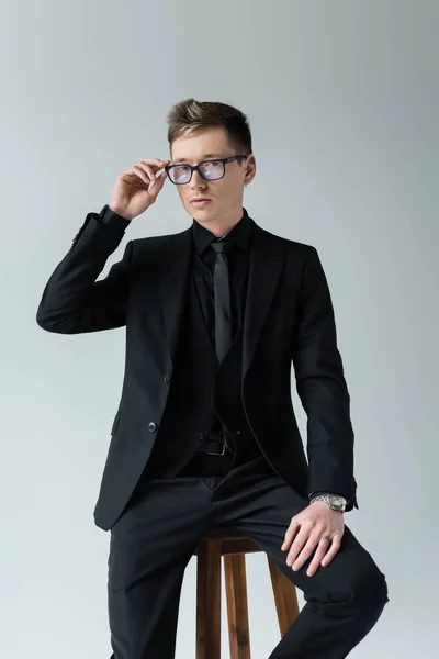 Man Formal Wear Holding Eyeglasses While Sitting Chair Isolated Grey — Stock Photo, Image