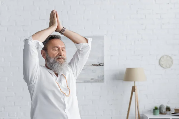 Senior Guru Man Meditating Arms Praying Hands Home — Stockfoto