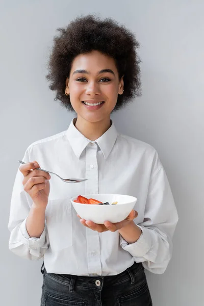 Young Cheerful African American Woman Holding Bowl Tasty Berries White — Stock Photo, Image