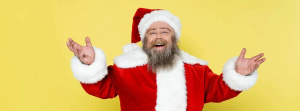 Excited Overweight Santa Claus Showing Greeting Gesture Isolated Yellow Banner — Fotografia de Stock