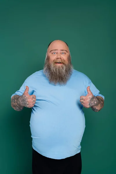 Bearded Overweight Man Blue Shirt Smiling Camera Showing Thumbs Isolated — 스톡 사진