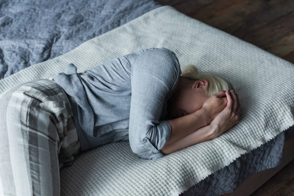 Blonde Woman Lying Bed Covering Face While Suffering Stomach Ache — Fotografia de Stock