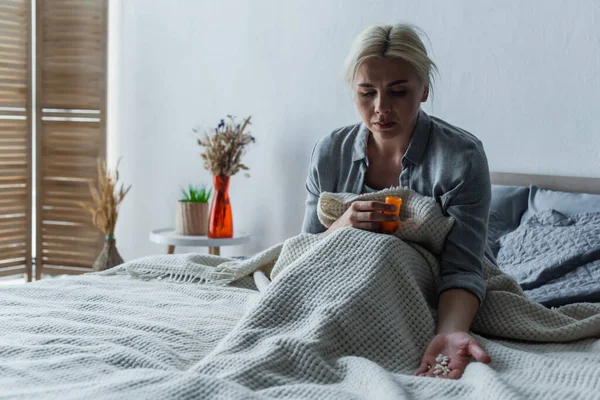 Sad Woman Climax Looking Bottle Painkillers While Sitting Bed Blanket — Stok Foto