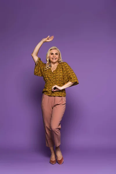 Full Length Joyful Blonde Woman Blouse Having Menopause Dancing Purple — Photo