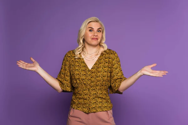 confused blonde woman with menopause showing shrug gesture on purple