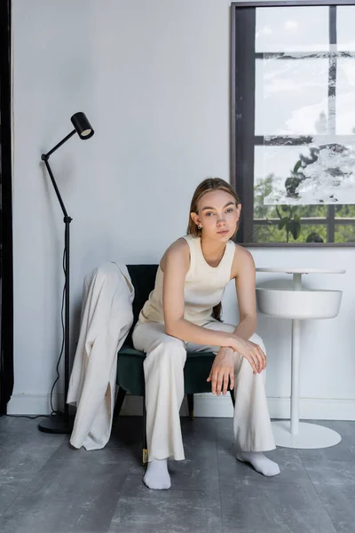 Full Length Stylish Woman Sitting Armchair Coffee Table Floor Lamp — Stockfoto