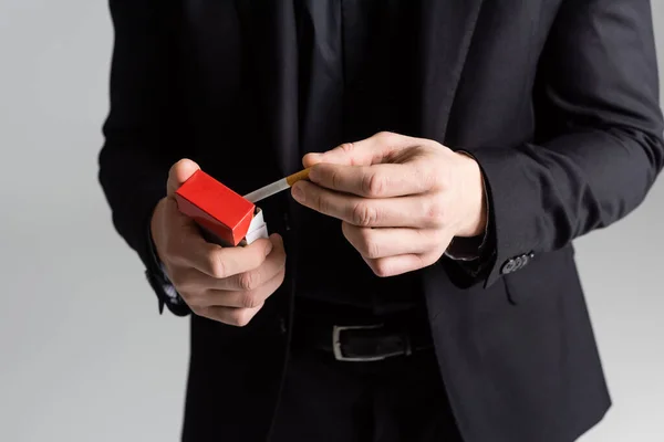 Partial View Man Black Formal Wear Holding Cigarette Pack Isolated — Stok fotoğraf