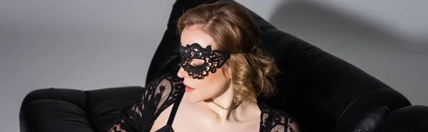 Sensual Woman Wavy Hair Wearing Black Lace Mask Grey Background — 스톡 사진