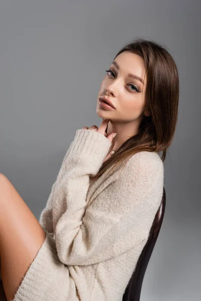 Sensual Woman Cozy Sweater Touching Neck Looking Camera Isolated Grey — Stockfoto