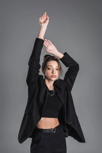 Young Woman Black Crop Top Blazer Posing Raised Hands Isolated — стоковое фото