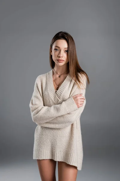 Young Pretty Woman Sweater Golden Necklaces Posing Crossed Arms Grey — Stockfoto