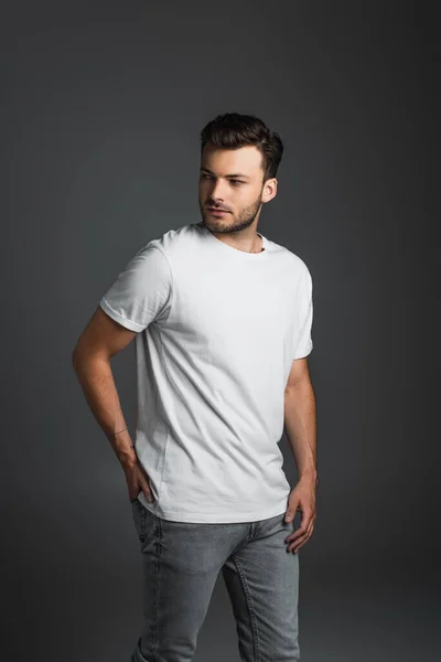 Young Man White Shirt Jeans Looking Away Isolated Grey — Foto de Stock